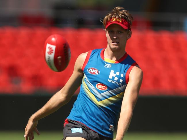 Jack Lukosius kicks during a Gold Coast Suns AFL training session at Metricon Stadium on March 20, 2019 in Gold Coast, Australia. (Photo by Chris Hyde/Getty Images)