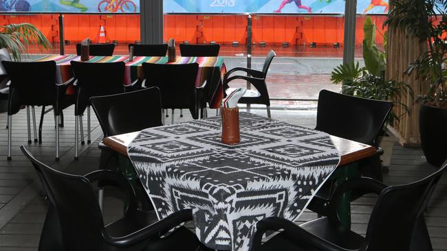 Empty restaurant tables in Coolangatta while the beach volleyball was on nearby. Picture Glenn Hampson