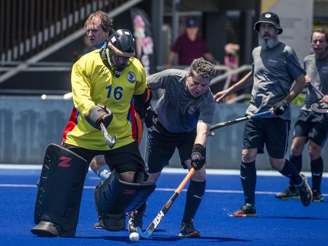 Action in the Pan Pacific Masters Games Hockey tournament. Picture: Glenn Campbell