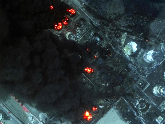 This handout satellite image released by Maxar Technologies shows a view of burning oil tanks in the port of Yemen's Huthi-held city of Hodeida. Picture: Maxar Technologies / AFP