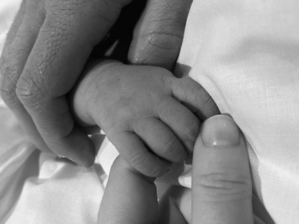 Eugenie posted a photo of her and husband Jack holding their new baby's hand in a continuation of a new style of royal birth announcements. Picture: Instagram