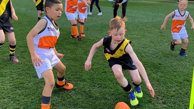 Calamvale Leopards playing in an NAB AFL Auskicker clash at the Gabba.