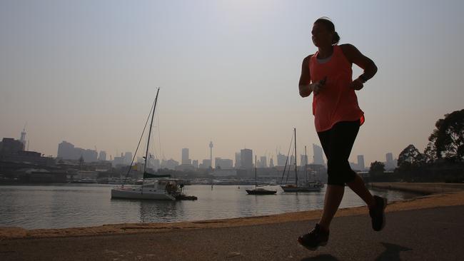 A jogger in Blackwattle Bay, Sydney. Picture: AAP