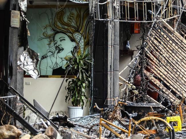 Damage to buildings is seen after a fire in a karaoke bar in Hanoi. Picture: AFP