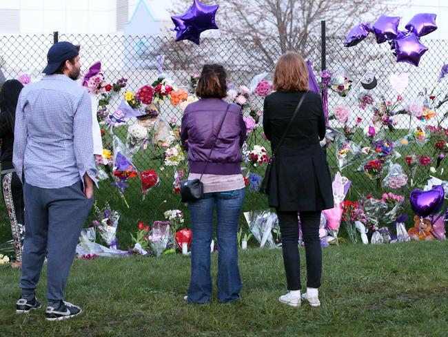 Prince mourners gather across the street from the singer’s home in Chanhassen, Minnesota. Picture: Splash News Australia