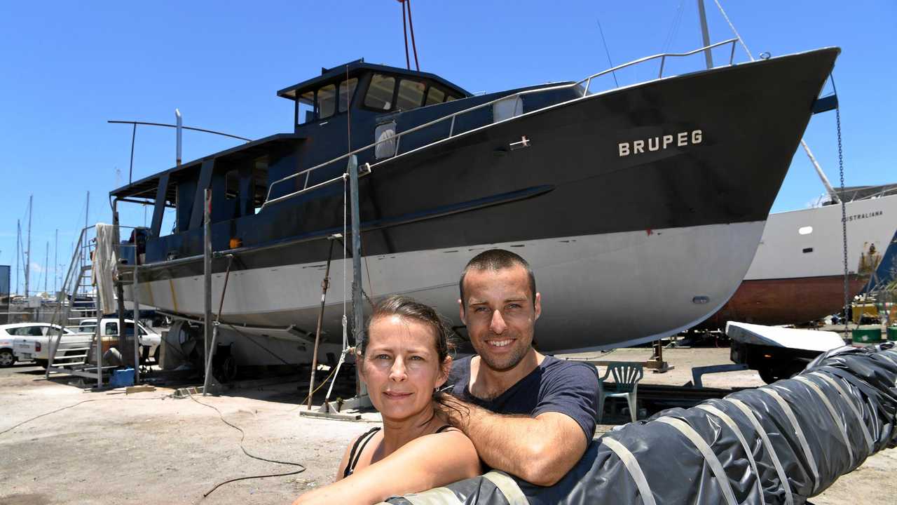 Jess and Damien Ashdown with their boat Brupeg. Picture: Mike Knott BUN281217BRUPEG1