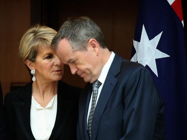 Opposition leader Bill Shorten and Foreign Minister Julie Bishop talk during the signing of a condolence book for the late Israeli President Shimon Peres at Parliament House in Canberra today.