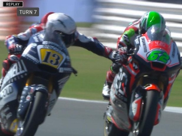 Moto2: Romano Fenati grabs the brake lever of rival Stefano Manzi mid-race.