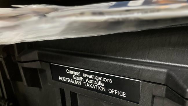 Australian Taxation Office investigators conducting raids on six individuals in Adelaide in connection with the Operation Protego GST refund scam. Picture: ATO