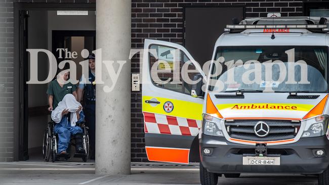 The 35-year-old woman under police escort at Sutherland Hospital on Thursday. Picture: Monique Harmer.