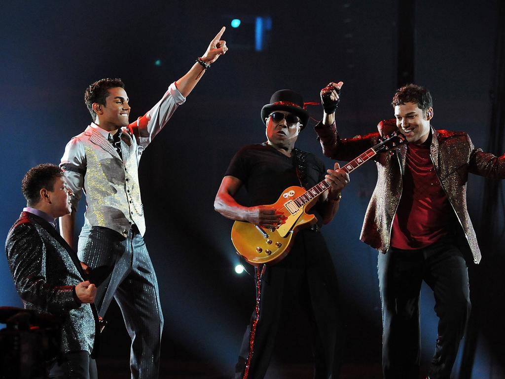 Sons Taj (left), TJ (second left) and Taryll (right) perform as 3T with their dad at the Michael Forever Tribute Concert in Wales in 2011. Picture: Tim Alban/Getty Images