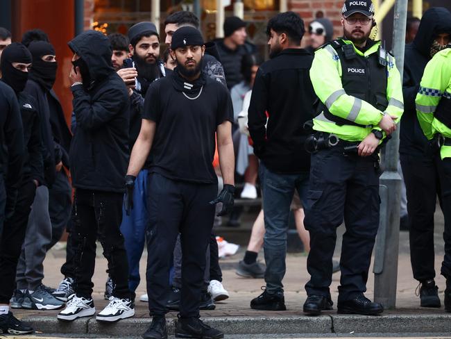 British Police patrol as anti-racism counter protesters gather ahead of a potential anti-immigration protest on August 7, 2024 in Preston, England. A series of anti-immigrant protests and riots have swept the country in the week after a deadly knife attack in Southport, England, fuelled by false rumours that the suspect was an asylum seeker. Picture: Jeff J Mitchell/Getty Images