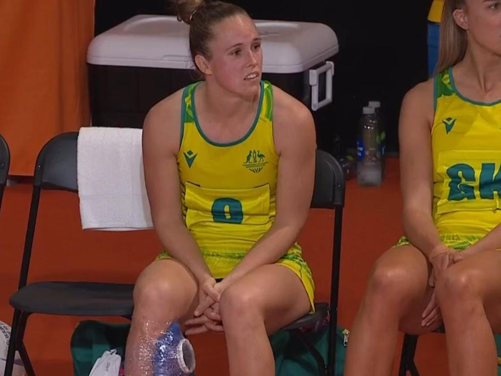 An injured Paige Hadley looks on from the Diamonds' bench.