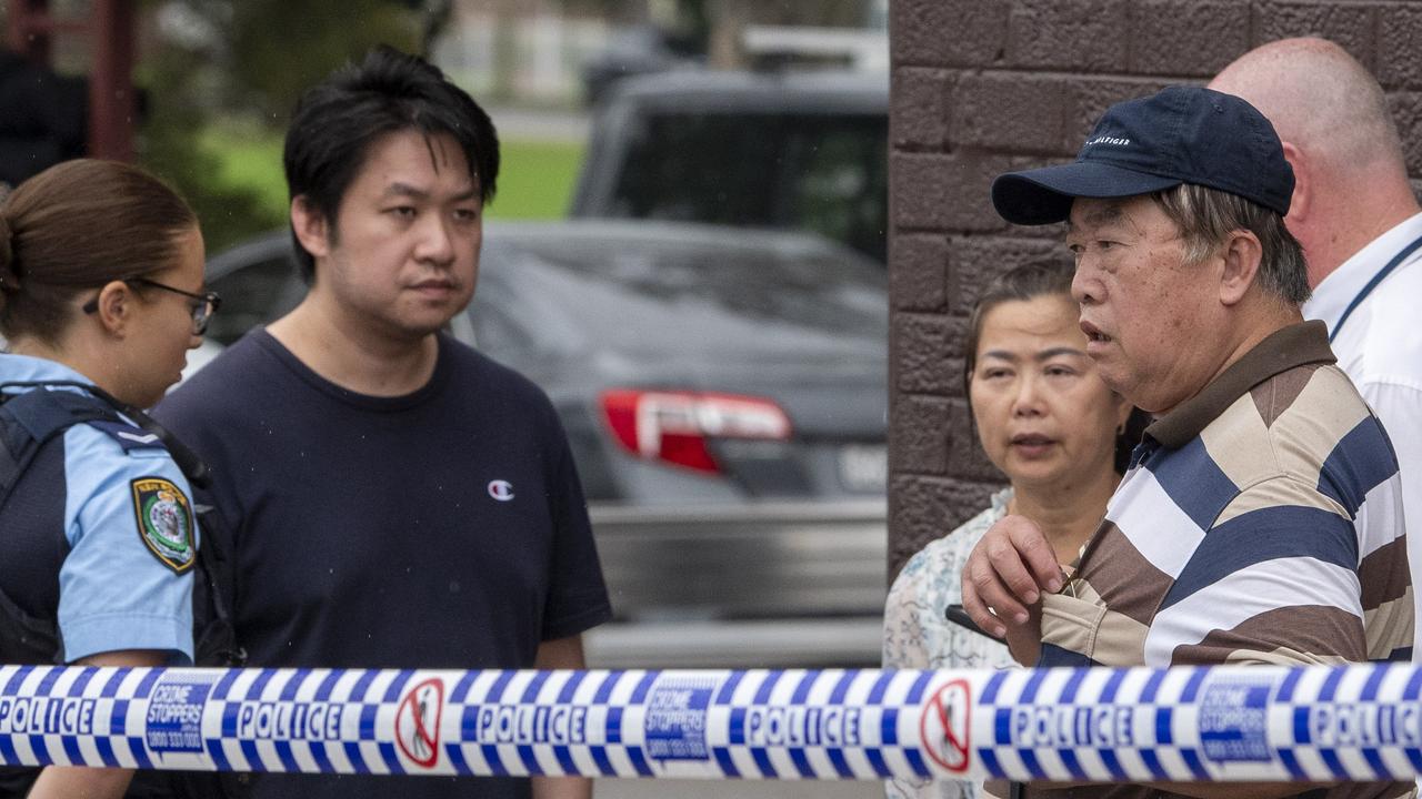 Family members talk with police. Picture: NewsWire / Simon Bullard.