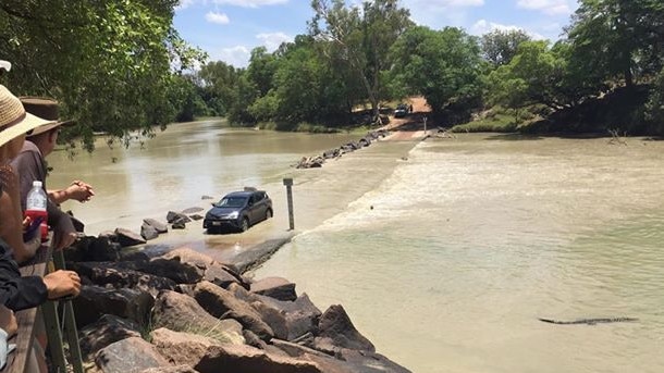 Yet another Cahills idiot as a man runs over croc in attempt to get over the flooded crossing. Picture: Supplied