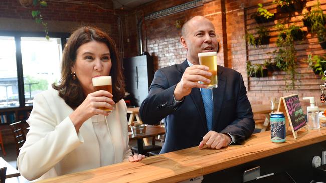 Federal Treasurer Josh Frydenberg has a beer in Melbourne with Minister for Financial Services Jane Hume. Picture: NCA NewsWire / Nicki Connolly