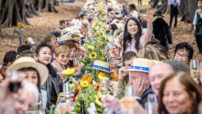 Foodies have packed into Treasury Gardens for the World's Longest Lunch. Picture: Jake Nowakowski