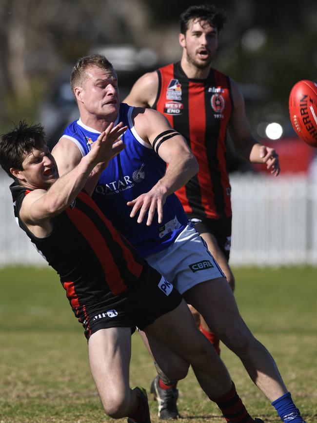 Rostrevor Old Collegians defender Sam Jonas competes for the footy against St Peter’s Old Collegians’ Jock McLeay during a match this season. Picture: Naomi Jellicoe