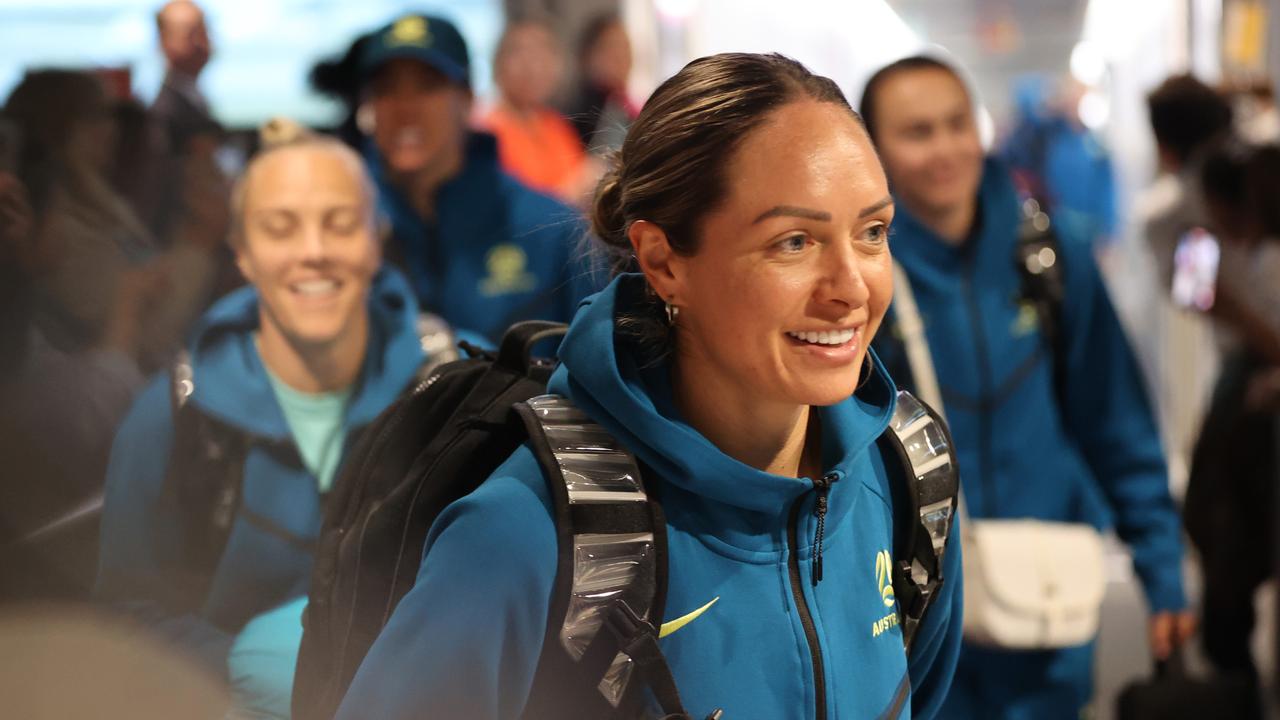 The Matildas were greeted by dozens of fans upon their return to Brisbane. Picture: Nigel Hallett