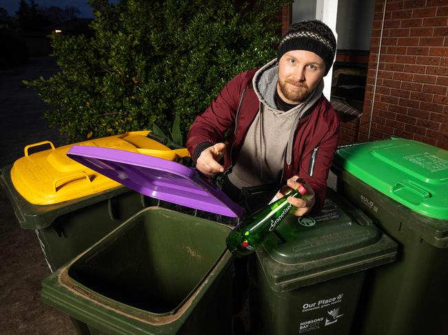 The state government is being urged to abandon its forced rollout of purple glass recycling bins. Picture: Mark Stewart