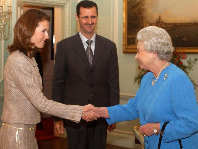 Queen Elizabeth II receives Asma al-Assad and her husband, then Syria's president Bashar Al-Assad, on December 17 2002, at Buckingham Palace. Picture: AFP