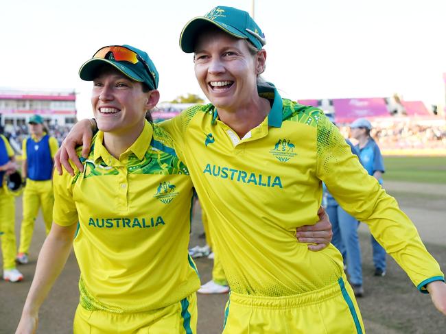 BIRMINGHAM, ENGLAND - AUGUST 07: Megan Schutt and Meg Lanning of Team Australia celebrate after winning the gold medal following the Cricket T20 - Gold Medal match between Team Australia and Team India on day ten of the Birmingham 2022 Commonwealth Games at Edgbaston on August 07, 2022 on the Birmingham, England.  (Photo by Alex Davidson/Getty Images)