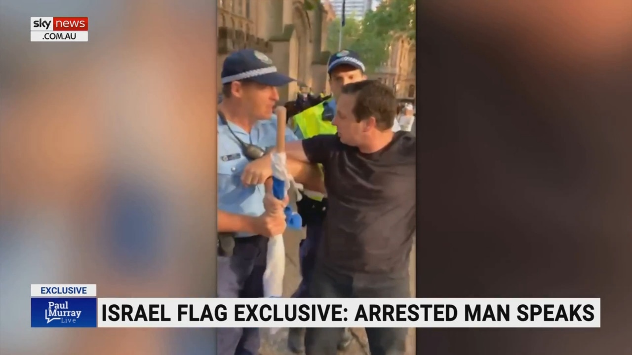 NSW Police drag man away from pro-Palestine rally for holding Israeli flag