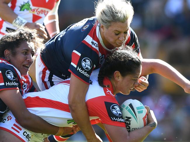 Ruan Sims of the Roosters tackles Najvada George of the Dragons during the NRLW Premiership Round 2 Match between St George Illawarra Dragons and Sydney Roosters at Leichhardt Oval in Sydney, Sunday, September 29, 2019. (AAP Image/Joel Carrett) NO ARCHIVING, EDITORIAL USE ONLY