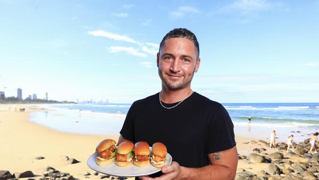 Nick Woodward from Rick Shores, Burleigh Heads with their famous bug rolls. Pics Adam Head