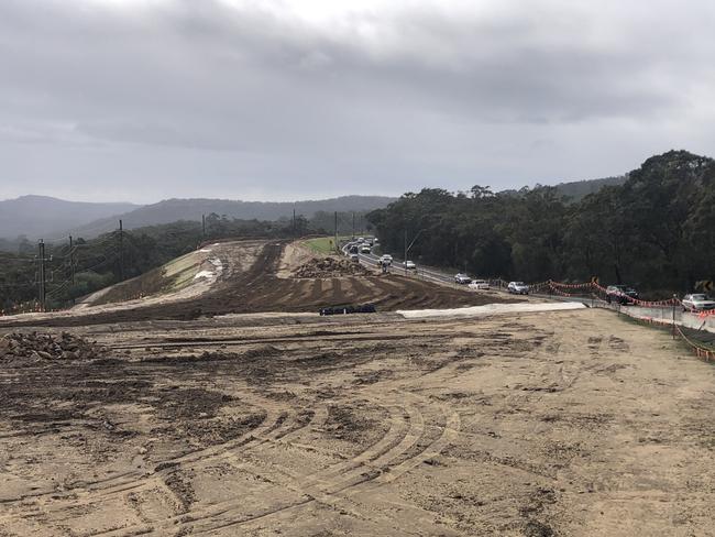 The 950m earth bank on a section of the deferred $340m upgrade to the 3.4km Mona Vale Road (West), between McCarrs Creek Rd at Terrey Hills and Powder Works Rd, Ingleside.