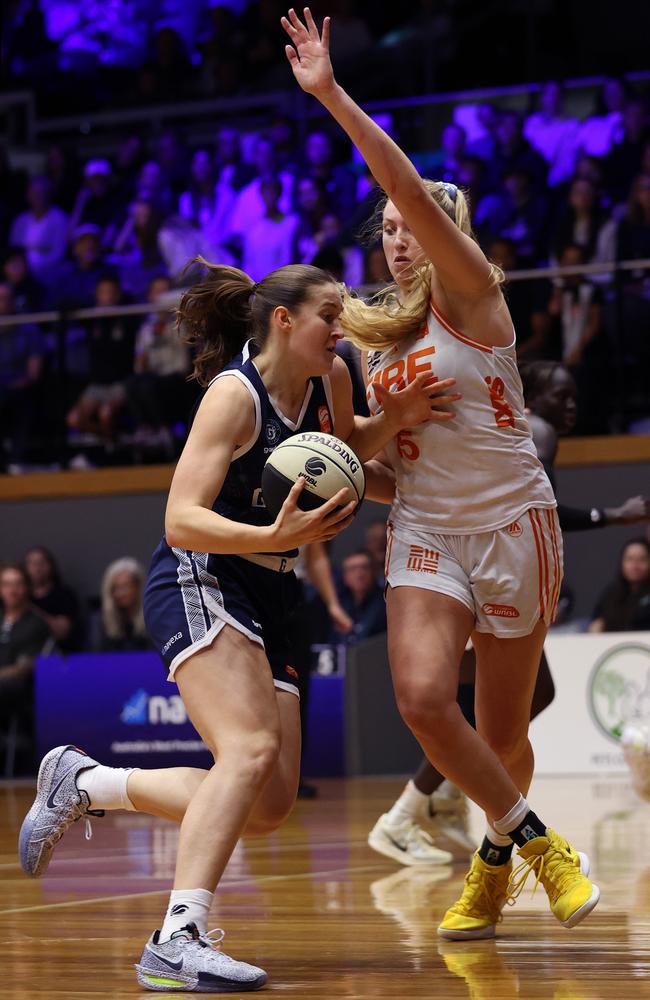 Hannah Hank of Geelong United drives past Lauren Cox of the Townsville Fire during the round one WNBL match between Geelong United and Townsville Fire at The Geelong Arena, on October 30, 2024, in Geelong, Australia. (Photo by Kelly Defina/Getty Images)