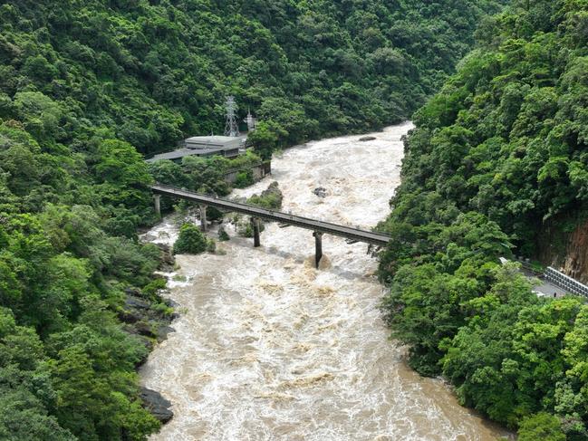 Heavy rain falls in Far North Queensland has seen a huge amount of water flow into the rivers and creeks around Cairns. The Barron River is a raging torrent of water near the hydro electricity plant in the Barron Gorge at Caravonica. Aerial drone picture: Brendan Radke