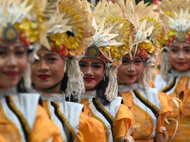 Balinese traditional dancers wait to perform a dance to release the sun of 2024, and to welcome the sun of 2025 during a New Year's Eve celebration in Denpasar. Picture: AFP