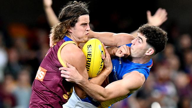 Jarrod Berry of the Lions collides with a Suns rival at the Gabba on Wednesday night Picture: Getty Images