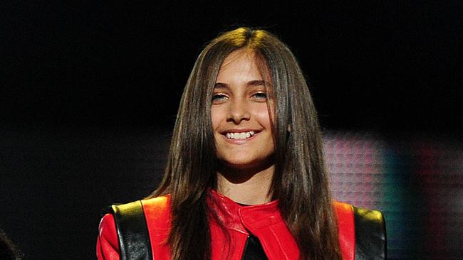 Michael Jackson's children, Prince Jackson (L), Blanket Jackson (C) and Paris Jackson (R) speak on stage during the 'Michael Forever' concert in memory of the late Michael Jackson at The Millenium Stadium in Cardiff, Wales on October 8, 2011. AFP PHOTO / LEON NEAL