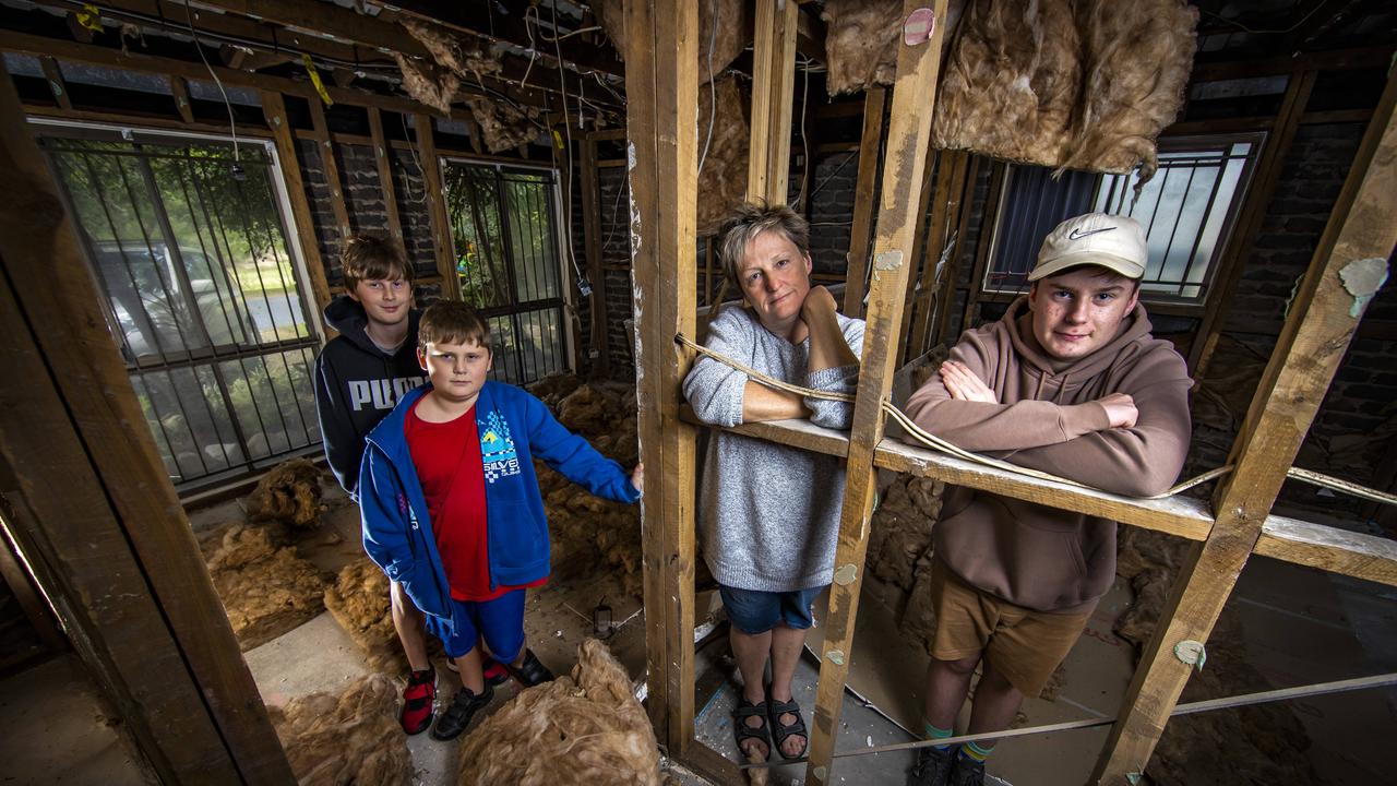 Corinda single mother of three Alison Lees with her boys Tomas, 12, James, 10 and Ben, 14 at their home that was destroyed by the recent floods. Picture: Nigel Hallett