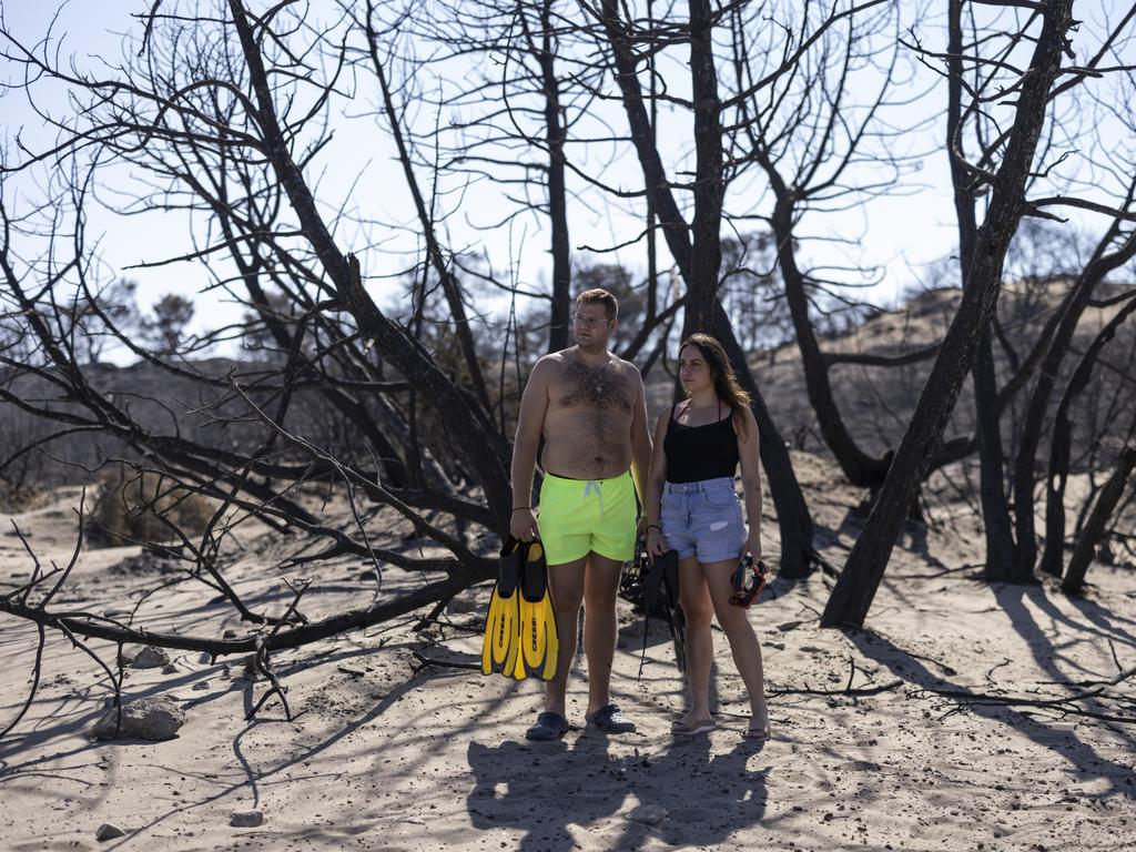 A couple from mainland Greece who were working at Mitsis Faliraki Beach Hotel in Rhodes, before everyone was evacuated during the fires. Picture: Getty Images