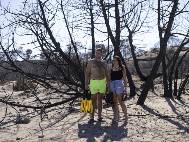 A couple from mainland Greece who were working at Mitsis Faliraki Beach Hotel in Rhodes, before everyone was evacuated during the fires. Picture: Getty Images