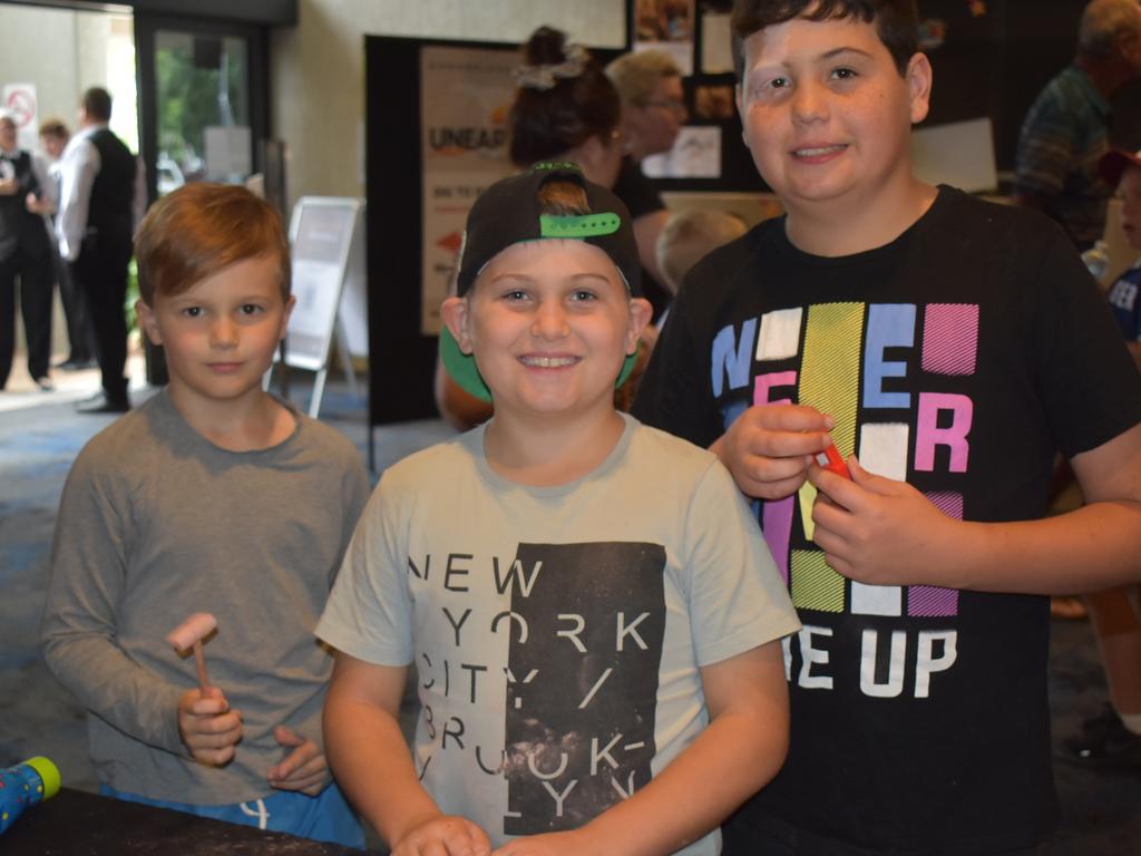 Torin Darr with Calum and Isaac Webster at the Queensland Museum Unearthed event in Mackay, August 2021. Picture: Lillian Watkins