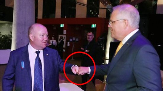 Old habits die hard: Shane Fitzgibbon and Scott Morrison share a fist bump.