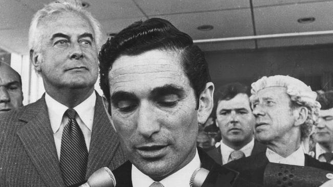 Gough Whitlam listens as Sir John Kerr’s secretary, David Smith, announces the dismissal.