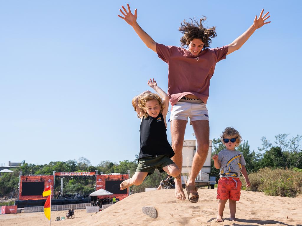 Making a stop in Darwin on their road trip around the country, Kade Scheffer, 4, Mason Little, 17, and Reed Scheffer, 2, secured a front-row seat for the Territory Day festivities at Mindil Beach in Darwin. Picture: Pema Tamang Pakhrin