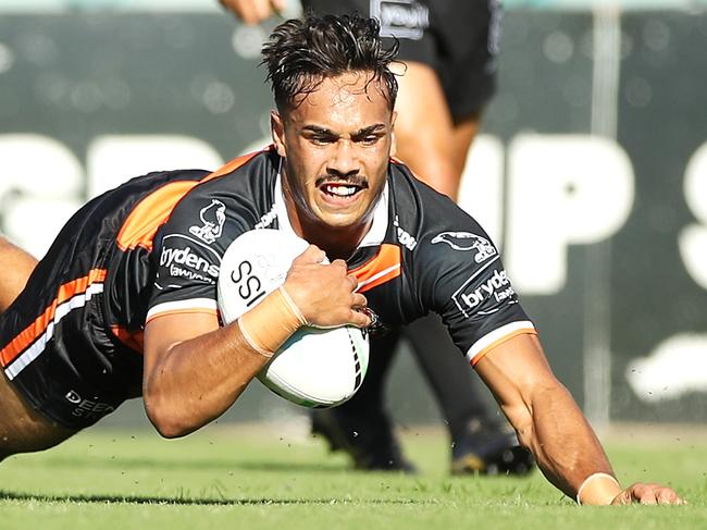 SYDNEY, AUSTRALIA - FEBRUARY 28: Daine Laurie of the Tigers  scores a try during the NRL Trial Match between the Wests Tigers and the Manly Sea Eagles at Leichhardt Oval on February 28, 2021 in Sydney, Australia. (Photo by Mark Kolbe/Getty Images)