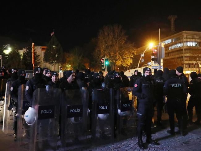 Riot police officers stand guard as people protest next to the US embassy in Ankara after Donald Trumps recognition of Jerusalem. Picture: AFP/Adem Altan