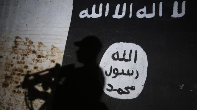 A hand-drawn version of the Islamic State flag was found in the teenager’s room, at a youth detention centre, in the past fortnight. Picture: Ahmad Al-Rubaye/AFP