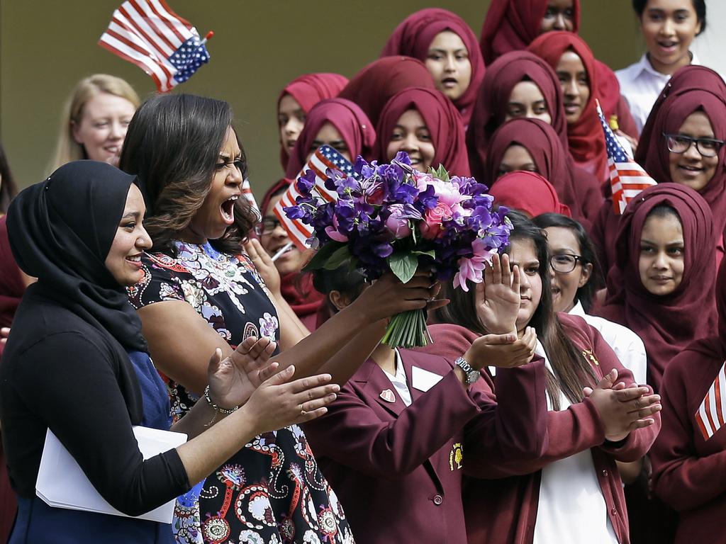 US First Lady Michelle Obama is greeted by pupils and teachers at Mulberry School for Girls in east London, Tuesday, June 16, 2015. Picture: AAP