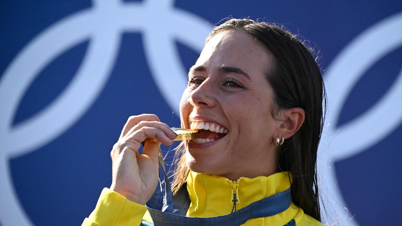 How sweet it is: Australia's gold medallist Noemie Fox celebrates on the podium during the medal ceremony after the women's kayak cross final of the canoe slalom. Picture: Olivier Morin/AFP