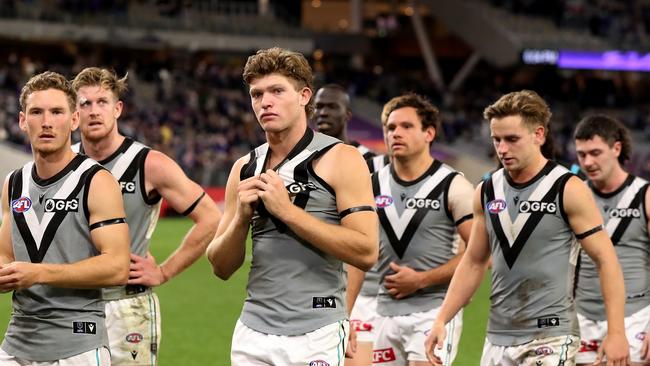 The Power leave the field after being defeated at Optus Stadium. Picture: Will Russell/AFL Photos via Getty Images