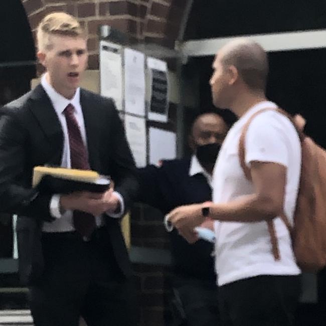 Juan Pablo Laureano Rojas ( in white shirt), 29, of Wollstonecraft, outside Manly Local Court with his solicitor Daniel Karooz. Picture: Jim O'Rourke