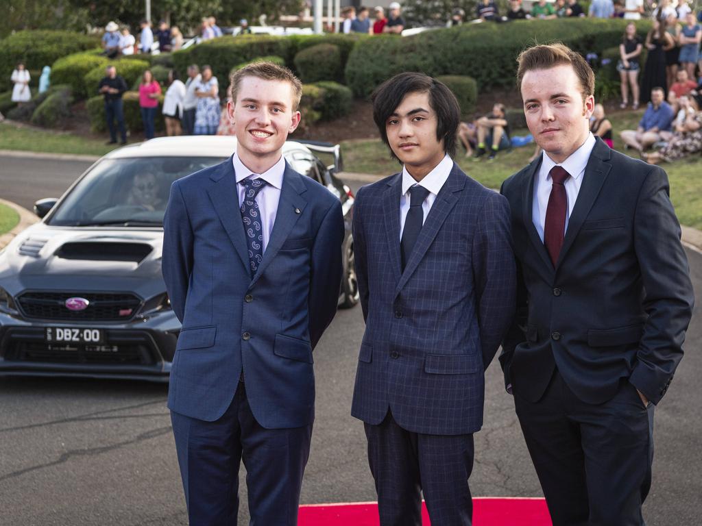 Graduates (from left) Matthew Kruger, Dylan Verches and Jack Franzmann arrive at Mary MacKillop Catholic College formal at Highfields Cultural Centre, Thursday, November 14, 2024. Picture: Kevin Farmer